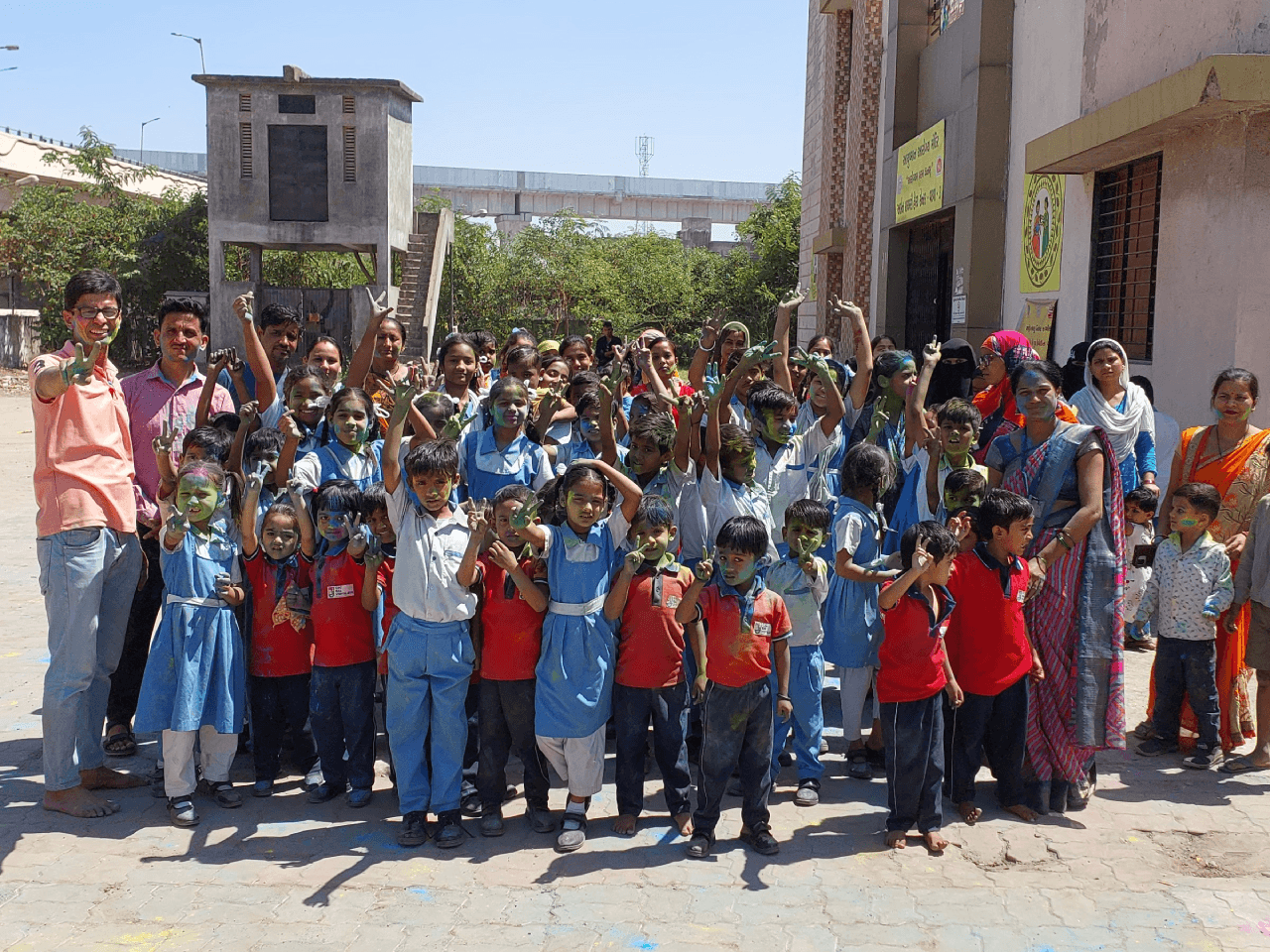 Children celebrating Holi at a Footpath School centre