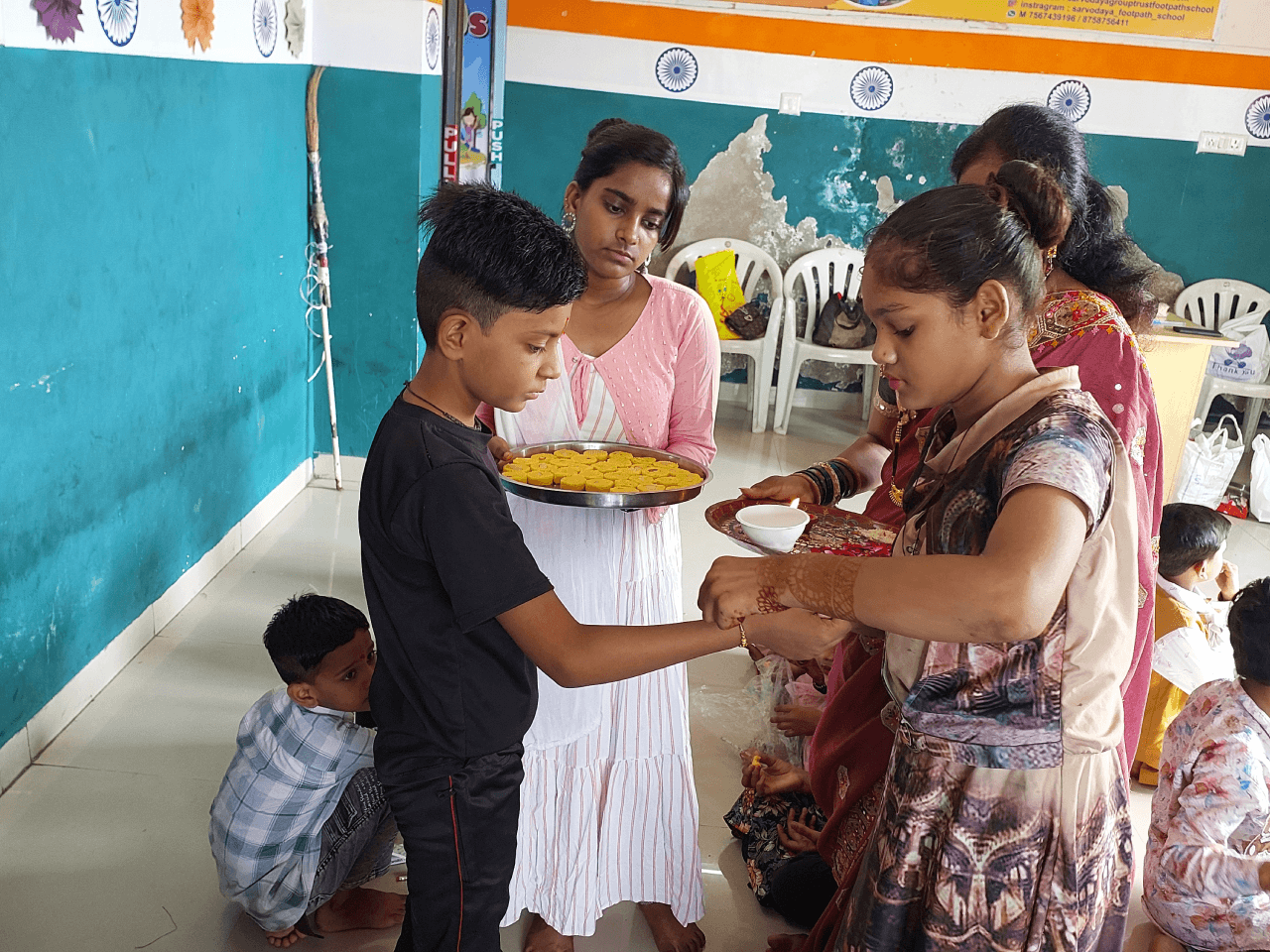 Children celebrating Raksha Bandhan at Footpath School