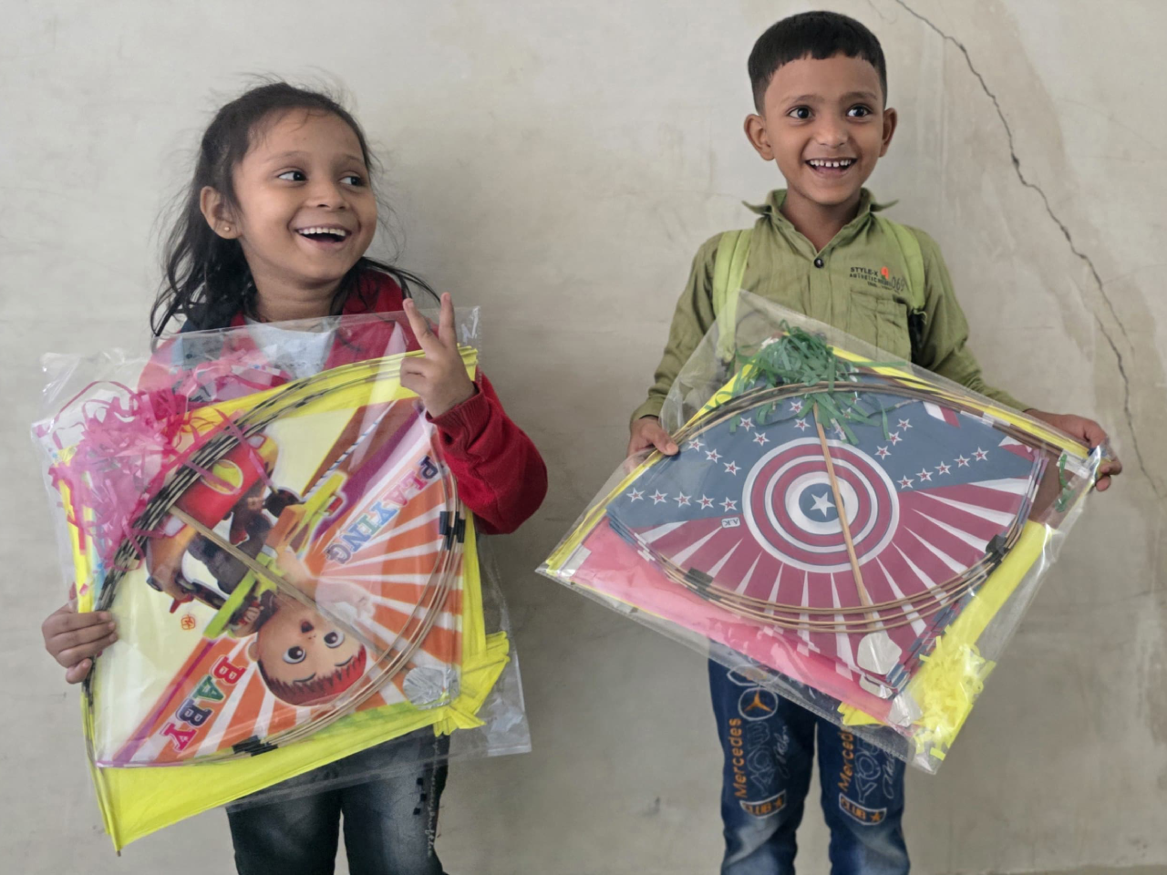 Children flying kites at the Uttarayan festival celebration, Footpath School Ahmedabad